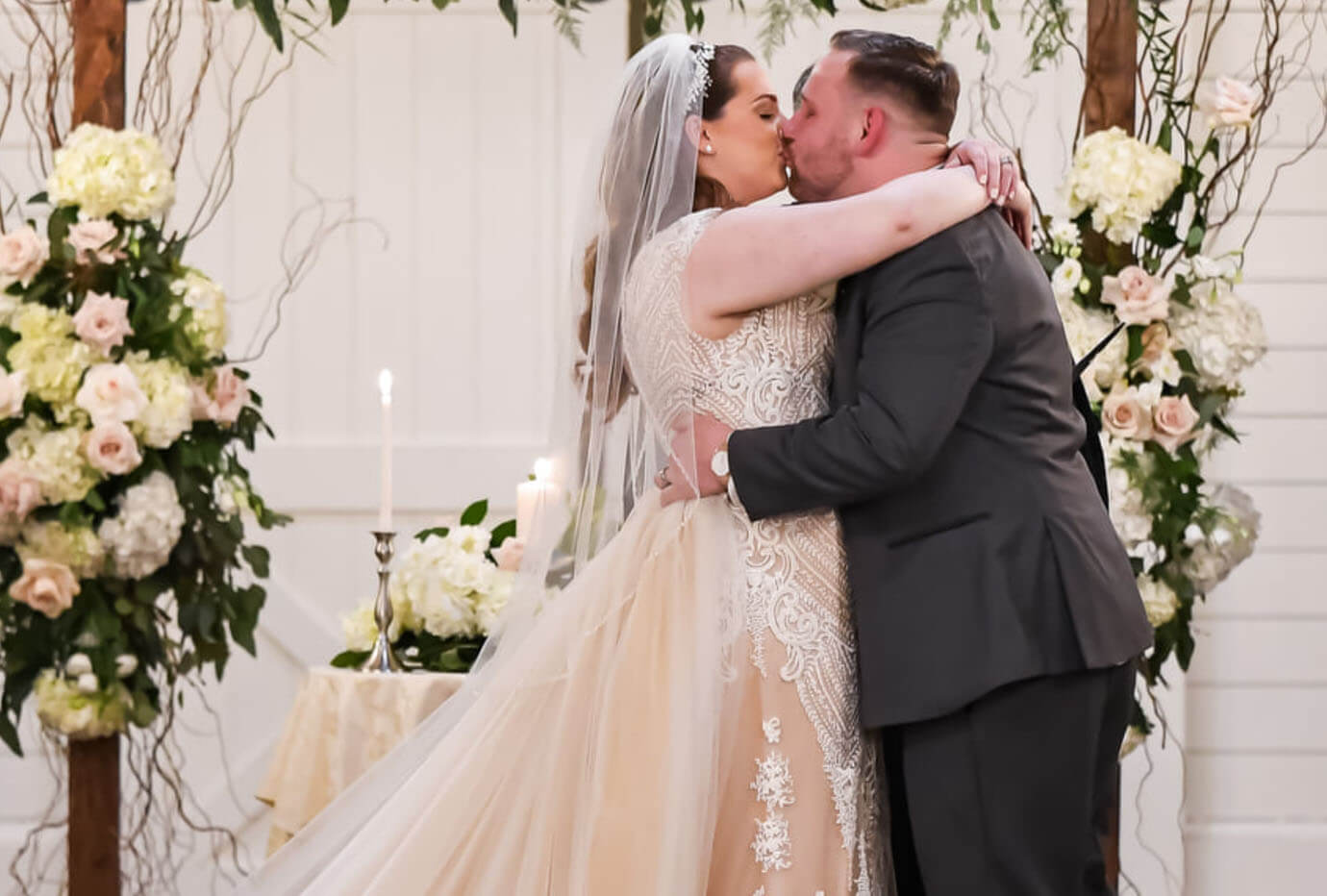 Сouple wearing a white gown and a black suit